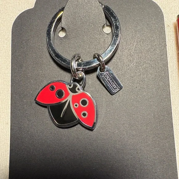 Coach Red Ladybug Keychain with Coach Pen - Picture 2 of 5